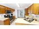 Kitchen with stainless steel appliances and wood cabinets at 466 Spauldingwood Rd., Little River, SC 29566