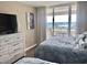 Bedroom with two twin beds, ocean view, and dresser at 9840 Queensway Blvd. # 330, Myrtle Beach, SC 29572