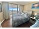 Ocean-view bedroom with a king-size bed and light wood furnishings at 9840 Queensway Blvd. # 330, Myrtle Beach, SC 29572