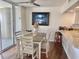 Bright dining room with ocean view and seating for four at 9840 Queensway Blvd. # 330, Myrtle Beach, SC 29572