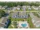 Aerial view showcases a blue condo complex, pool, and well-maintained landscaping, parking and other homes at 1930 Bent Grass Dr. # 40K, Surfside Beach, SC 29575
