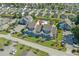 Aerial view of blue condo buildings, a sparkling blue pool, and a well manicured lawn and parking areas at 1930 Bent Grass Dr. # 40K, Surfside Beach, SC 29575
