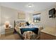 Bedroom with a queen-sized bed, bedside tables, and plenty of natural light at 1930 Bent Grass Dr. # 40K, Surfside Beach, SC 29575