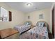 Comfortable bedroom featuring twin beds with seahorse motif and a window letting in natural light at 1930 Bent Grass Dr. # 40K, Surfside Beach, SC 29575