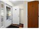 Welcoming entryway with storm door, unit number, and a peek into the interior of this home at 1930 Bent Grass Dr. # 40K, Surfside Beach, SC 29575