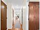 Bright hallway with wood floors and neutral walls, offering access to various rooms in the home at 1930 Bent Grass Dr. # 40K, Surfside Beach, SC 29575