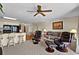 Spacious living room and kitchen with cozy seating, breakfast bar, and natural light from the patio at 1930 Bent Grass Dr. # 40K, Surfside Beach, SC 29575