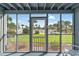 Enjoy views of the manicured lawn and community amenities from the screened-in sunroom at 1930 Bent Grass Dr. # 40K, Surfside Beach, SC 29575