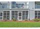 A view of an enclosed sunroom that features a lawn and landscape view with community pool at 1930 Bent Grass Dr. # 40K, Surfside Beach, SC 29575
