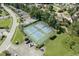 Aerial shot showcases well-maintained tennis courts nestled within lush landscaping at 1930 Bent Grass Dr. # 40K, Surfside Beach, SC 29575