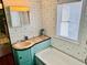 Vintage-style bathroom with polka-dot wallpaper, sink, and bathtub, offers classic charm at 6001 - 5410 S Kings Hwy., Myrtle Beach, SC 29575