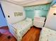 Cozy bedroom with two twin beds and a playful llama-themed décor at 6001 - 5410 S Kings Hwy., Myrtle Beach, SC 29575