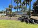 Ocean Lakes community entrance with attractive signage surrounded by palm trees and lush landscaping at 6001 - 5410 S Kings Hwy., Myrtle Beach, SC 29575