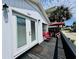 Inviting deck with red chairs, perfect for outdoor lounging and enjoying the coastal breezes at 6001 - 5410 S Kings Hwy., Myrtle Beach, SC 29575