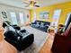 Bright living room with ample seating, featuring wood floors and access to the outdoors at 6001 - 5410 S Kings Hwy., Myrtle Beach, SC 29575