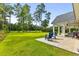 Spacious backyard with patio, fire pit, and wooded views at 790 Caines Landing Rd., Conway, SC 29526