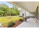 Covered porch with stone pillars and view of the front yard at 790 Caines Landing Rd., Conway, SC 29526