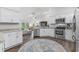 Modern kitchen with white cabinets, stainless steel appliances and a view of the living room at 790 Caines Landing Rd., Conway, SC 29526