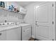 Bright laundry room features washer, dryer, and shelving at 790 Caines Landing Rd., Conway, SC 29526