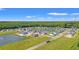 Aerial view of a new housing development with ponds, green spaces, and newly constructed homes at 1124 Cypress Shoal Dr., Conway, SC 29526