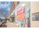 Vintage Coca-Cola mural on side of brick building with colorful awning and gas pump at 1124 Cypress Shoal Dr., Conway, SC 29526