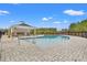 Community outdoor pool featuring a covered lounge area and brick paved pool deck at 1124 Cypress Shoal Dr., Conway, SC 29526