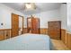 Cozy bedroom with wood-paneled walls and a built-in wardrobe at 1861 Jenerette St., Mullins, SC 29574