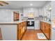 View of kitchen with wood cabinets and a breakfast bar at 1861 Jenerette St., Mullins, SC 29574