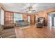 Living room with brick fireplace, tiled floors, and ample seating at 1861 Jenerette St., Mullins, SC 29574