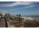 Picturesque beach view with boardwalk, palm trees, a ferris wheel, and the ocean in the background at 1060 Log Cabin Rd., Loris, SC 29569