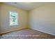 Cozy bedroom with plush carpeting and a window providing natural light at 1060 Log Cabin Rd., Loris, SC 29569