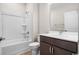 Clean bathroom featuring a tub shower combo and dark vanity at 284 Starlit Way, Myrtle Beach, SC 29579