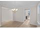 Bright dining room with chandelier and hardwood floors at 284 Starlit Way, Myrtle Beach, SC 29579