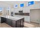 Modern kitchen with white cabinets, large island, and herringbone backsplash at 284 Starlit Way, Myrtle Beach, SC 29579