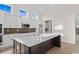 Island kitchen with dark lower cabinets and white upper cabinets at 284 Starlit Way, Myrtle Beach, SC 29579