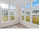 Sunroom with wall-to-wall windows offering abundant natural light at 284 Starlit Way, Myrtle Beach, SC 29579