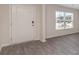 Bright entryway with gray vinyl plank flooring and a white door at 315 Acosta Circle, Conway, SC 29527