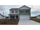 Two-story house with gray siding, white accents, and a two-car garage at 315 Acosta Circle, Conway, SC 29527