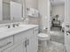 Bathroom featuring a single vanity, toilet, tile floor, and neutral decor at 4989 Salt Creek Ct., North Myrtle Beach, SC 29582