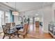 Cozy dining area adjacent to a spacious living room with open sight-lines to the living room at 4989 Salt Creek Ct., North Myrtle Beach, SC 29582