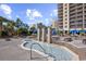 Zero-entry splash pool with water features, and lounge area with tables at 4989 Salt Creek Ct., North Myrtle Beach, SC 29582