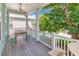 Outdoor porch features wood floors, table and benches at 4989 Salt Creek Ct., North Myrtle Beach, SC 29582