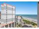 Balcony view featuring a beach, blue ocean, and neighboring high-rise condos at 7100 N Ocean Blvd. # 1023, Myrtle Beach, SC 29572