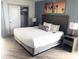 Relaxing bedroom with King bed, warm decor, closet, and modern lamps at 7100 N Ocean Blvd. # 1023, Myrtle Beach, SC 29572