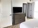 Bright bedroom with television, and a large closet for storage at 7100 N Ocean Blvd. # 1023, Myrtle Beach, SC 29572