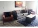 Cozy living room with modern furniture, blue accent rug, and beach-themed wall art at 7100 N Ocean Blvd. # 1023, Myrtle Beach, SC 29572