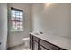 A bathroom with a sink, toilet and a window that provides natural light and views at 1348 Peterson St., Myrtle Beach, SC 29577