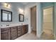 A well-lit bathroom features a double sink vanity and walk-in closet at 1348 Peterson St., Myrtle Beach, SC 29577