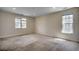 Spacious carpeted bedroom with two large windows providing ample natural light at 1348 Peterson St., Myrtle Beach, SC 29577