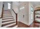 An inviting entryway features hardwood stairs and a bright, welcoming front door at 1348 Peterson St., Myrtle Beach, SC 29577